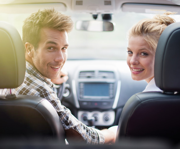 Young couple in car.